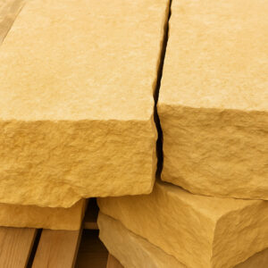 Close-up of two large blonde stone steps with a natural split between them