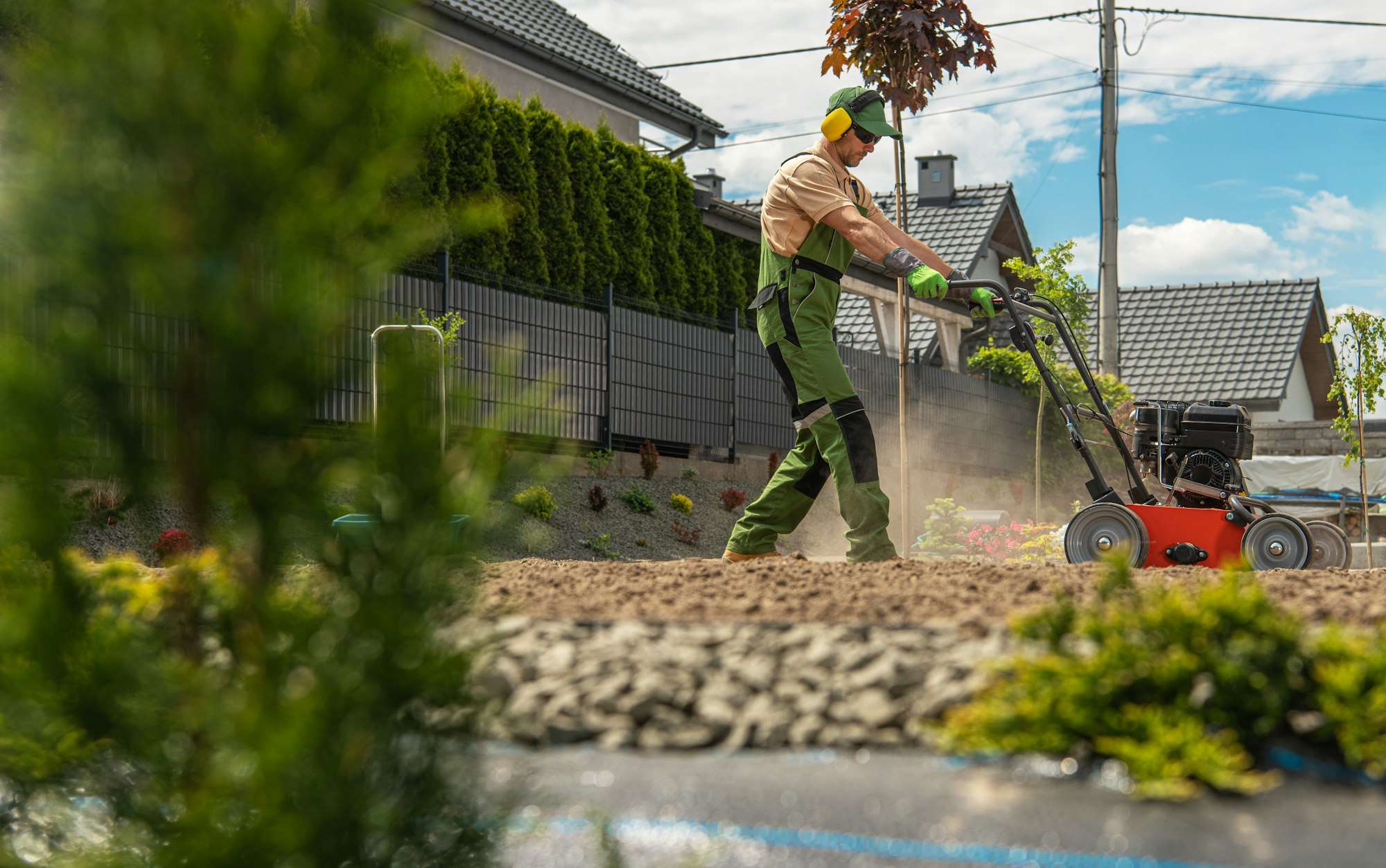 Modern Landscaper Preparing Backyard Soil