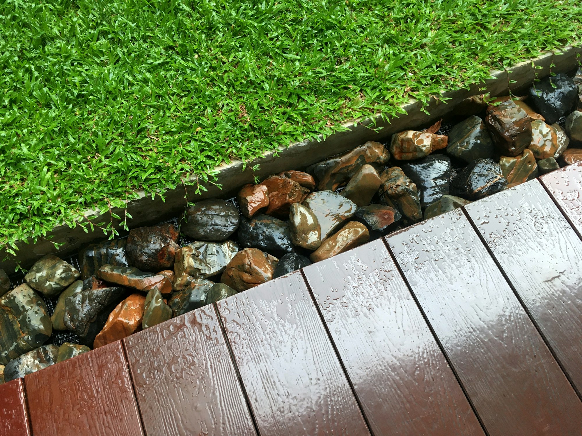 Lawn and rocks at the edge of balcony