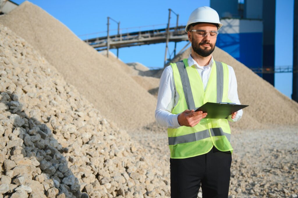 An engineer at a crushed stone or gravel plant. Stone mining